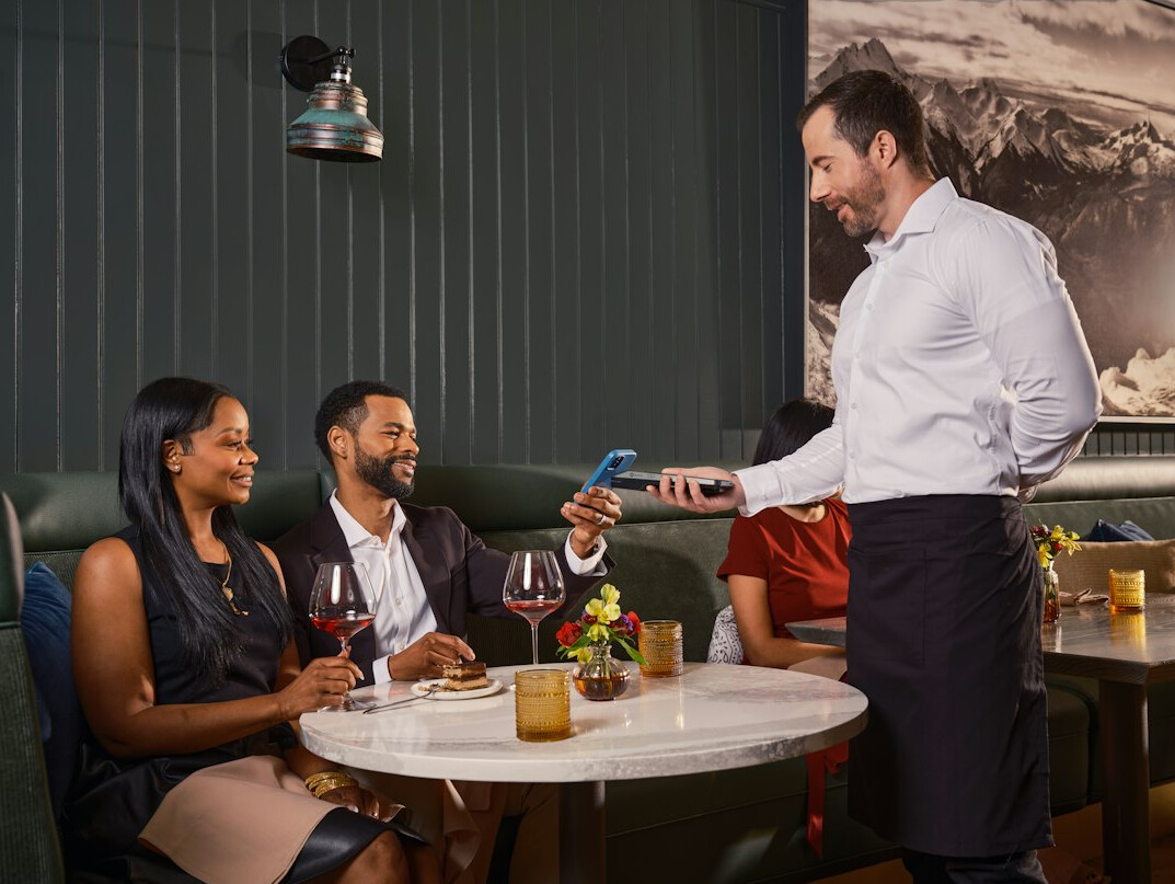 Team of professionals in a friendly discussion at a table