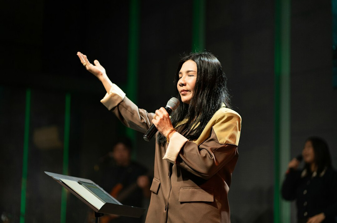 Woman speaking confidently at an event