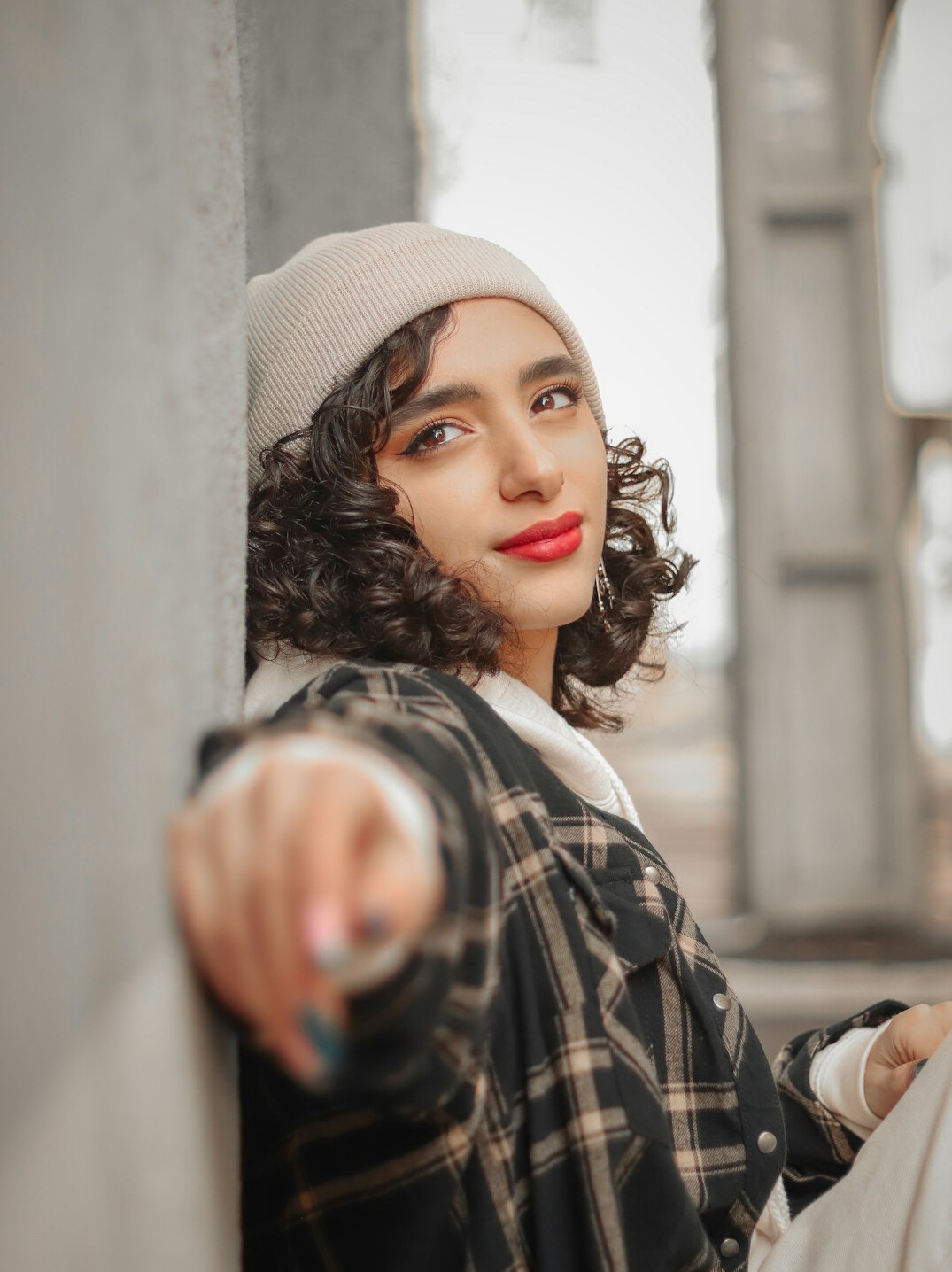 Portrait of a smiling young woman with curly hair