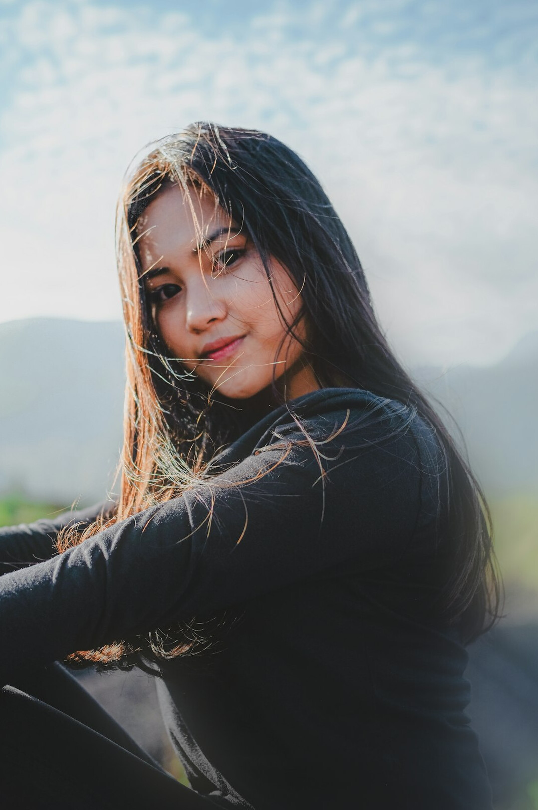 Portrait of a smiling woman with long hair
